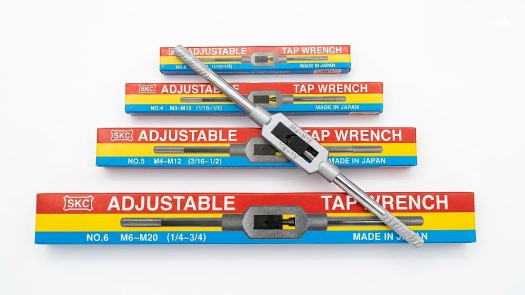ADJUSTABLE TAP WRENCH
